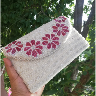 Elegant White Beaded Clutch Adorned with Pink Blossoms